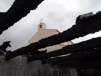 The Church of the Multiplication as seen through the burnt roof of an auxiliary building next to the church. The perpetrators of this arson attack - Jewish extremists - have been arrested and sentenced by Israeli court.