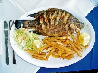 Tilapia zillii (redbelly tilapia, "St. Peter's fish"), typical serving in a Tiberias restaurant